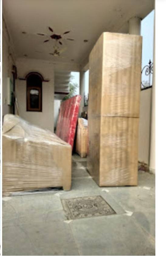 Almirah and bed packed inside an apartment