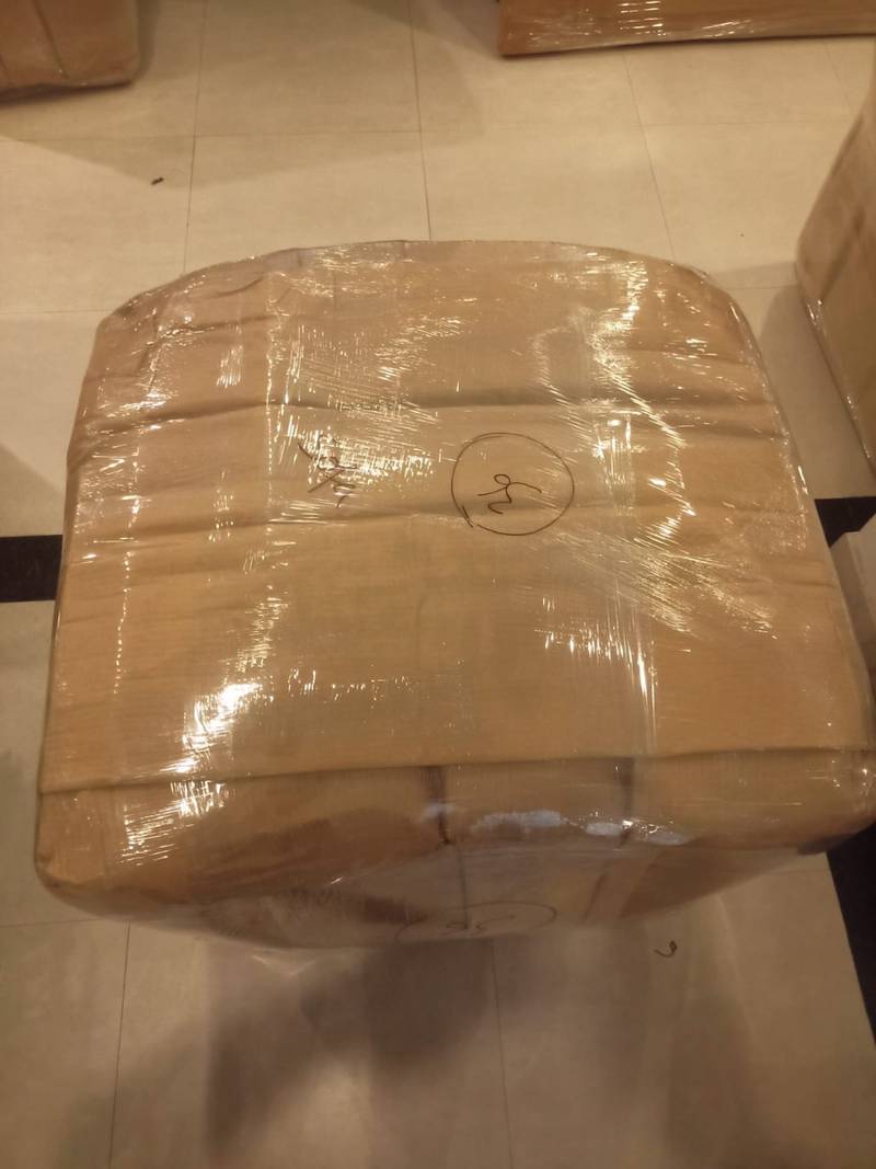 Washing machine packed in corrugated wrap